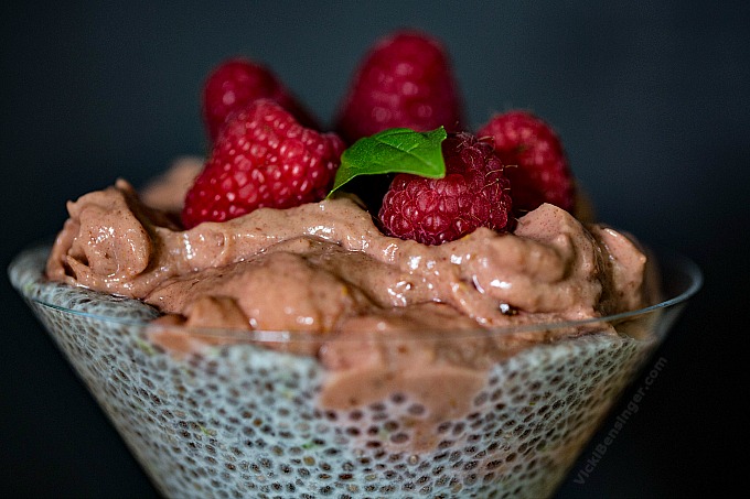 Raspberry Mousse & Chia Parfait topped with fresh Raspberries and sprig of basil
