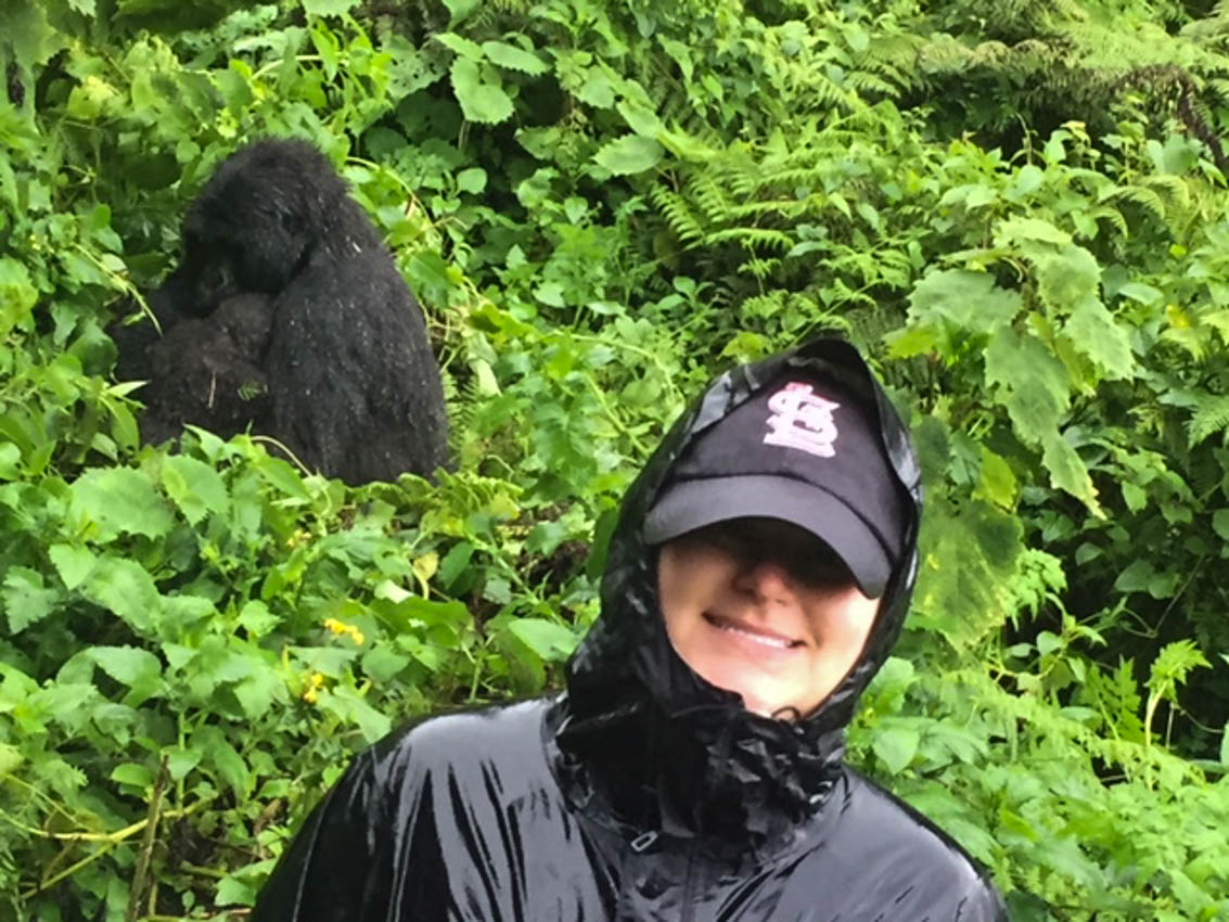 My daughter close to a gorilla while trekking in Rwanda
