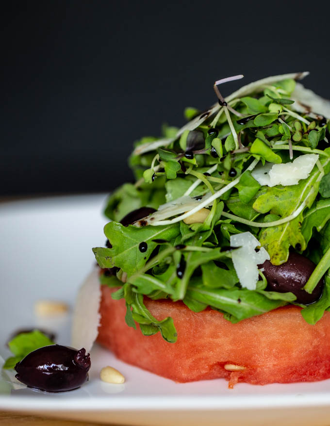 Watermelon Salad with Peccorino, Kalamata Olives, Pine Nuts and Balsamic Reduction