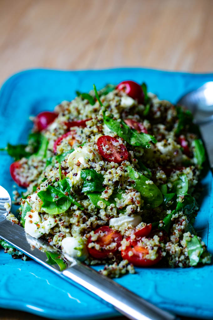 Caprese Quinoa Salad with fresh mozzarella, baby tomatoes, spinach & basil pesto