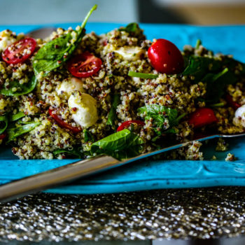 Caprese Quinoa Salad with fresh mozzarella, baby tomatoes, spinach & basil pesto