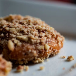 Apricot Delight - a dried apricot dipped in caramel & rolled in crushed pecans