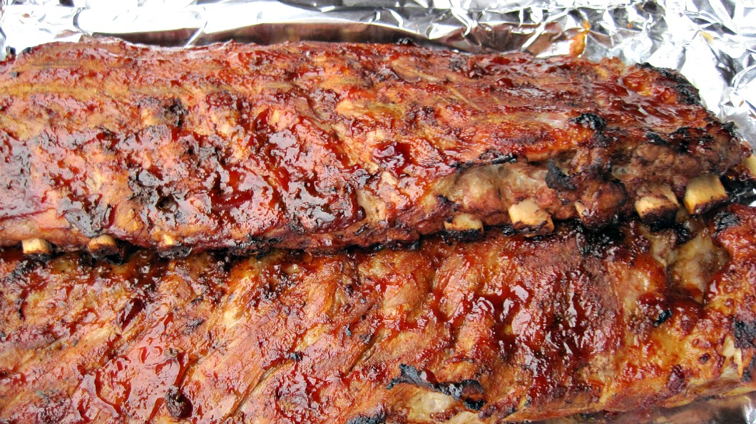 Easy Oven Baked BBQ Ribs, are tender in the inside, crispy outside and full of flavor