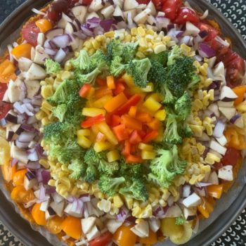 Rainbow Pizza with a sweet potato crust, bell peppers, corn,onions, butternut squash, eggplant, and broccoli