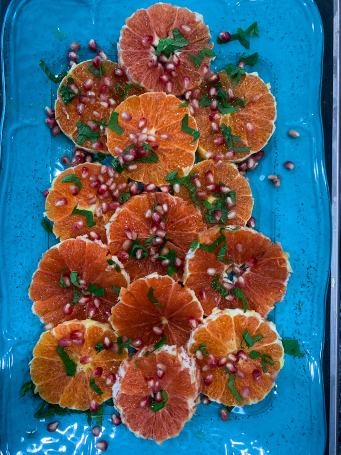 Orange and Pomegranate Salad with warm spices, slivered onions and pomegranate arils with a honey lime vinaigrette